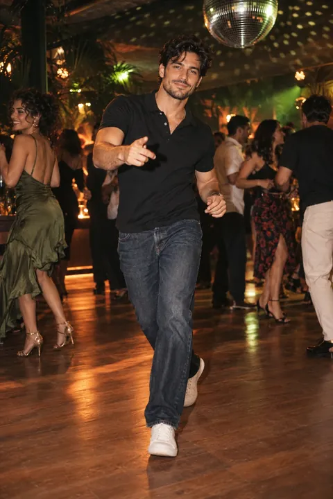 Source photo used for the sample: a fictional adult dancer on a warm party floor